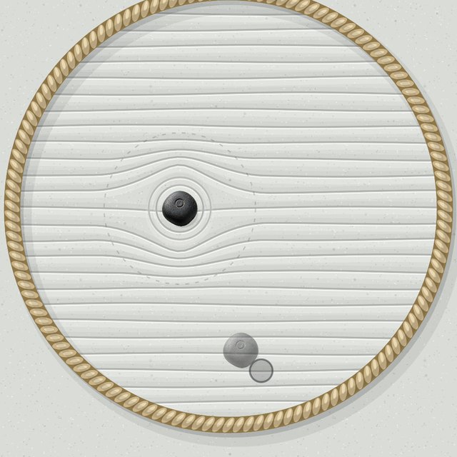 A dark pull stone in the ring with its reach zone drawn around it, and a second stone dropping in below