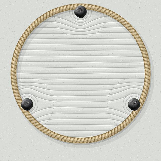 A smaller rope ring with three stones pressed against it